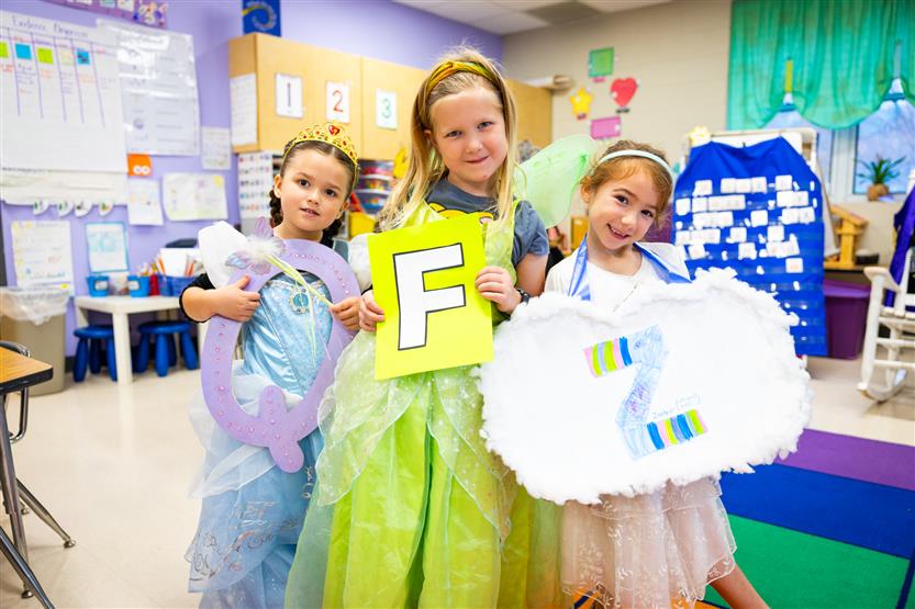 Students participate in an alphabet parade